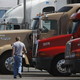 A truck driver returns to his vehicle, veins glowing a faint green from light Monster Energy poisoning.
